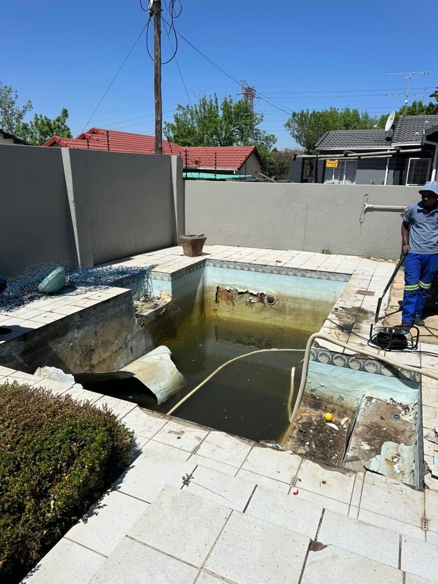 Swimming pool with a leak being drained ahead of repair, Randburg